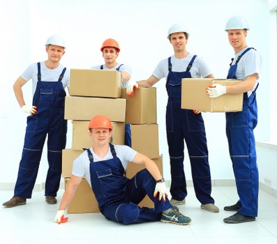 Professional movers handling furniture for storage